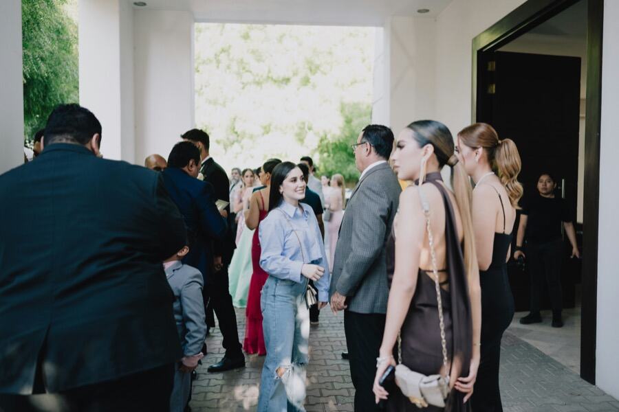 Guests chatting outside a venue entrance